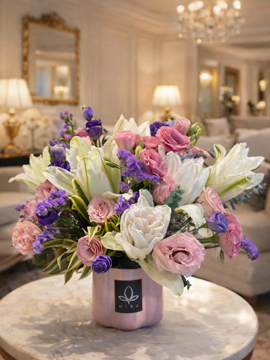 Lily Serenade — white lilies, pink roses, and purple lisianthus in a pink MIRA vase